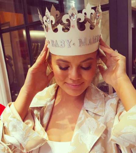 Chrissy Teigen dons Baby Mama crown at baby shower.