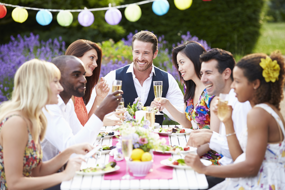 Group Of Friends Enjoying Outdoor Dinner Party