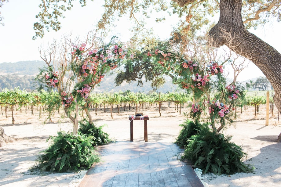 Celebrity weddings | Skyler Astin and Anna Camp’s Vineyard Wedding | Floral Arbor | Outdoor Ceremony 