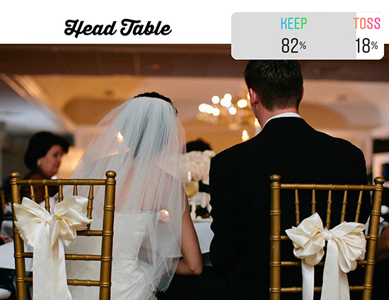 bride and groom sitting at head table gold chiavari chairs white satin bows