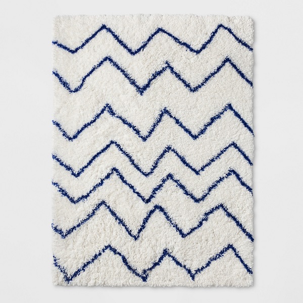 A shag rug is the quintessential go-to for a plush texture, so consider adding one to your baby’s small space nursery.