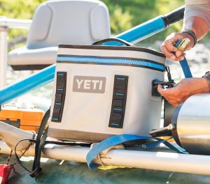 Food and drinks stay cold and safe from the elements with a sturdy Yeti cooler on board.