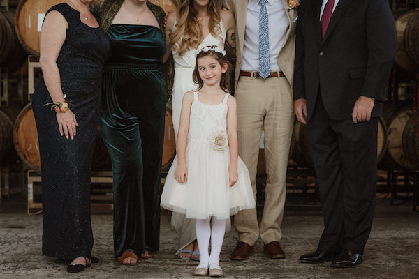 Your wish list of family photos could wind up including a few extra shots you weren’t planning for—like a photobomb from your show-stealing flower girl!