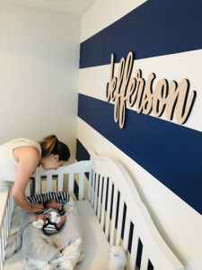 painting a striped wall in our nursery