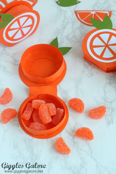 DIY boxes are filled with orange candies 