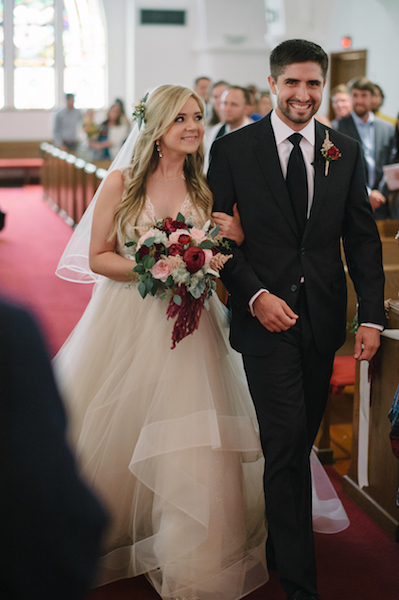 Bride and Groom walking down the aisle