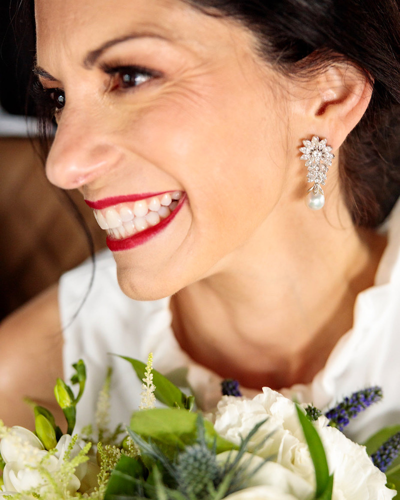 Sarah wore her grandmother’s diamond earrings for her “something old” and “something borrowed!”