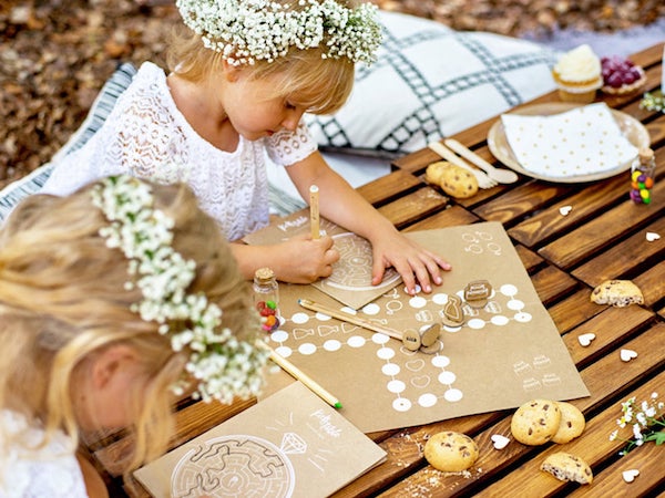 Flower girls playing games at wedding | Kids table wedding activity