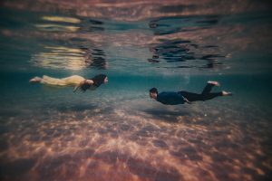 under water photo of couple