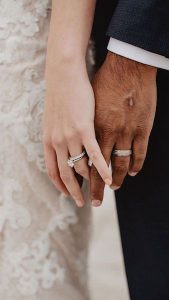 wedding bands and hands