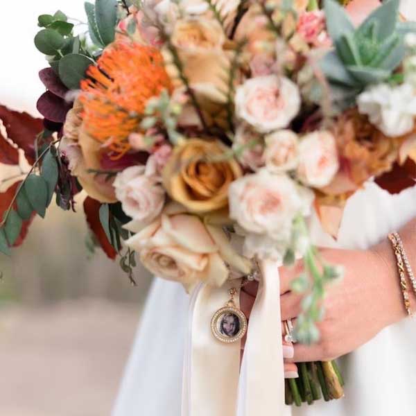 memorial locket on wedding bouquet 