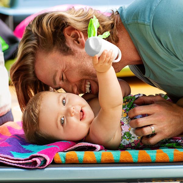 dad changing baby