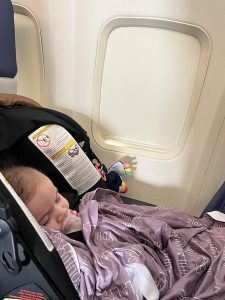 baby sleeping on plane